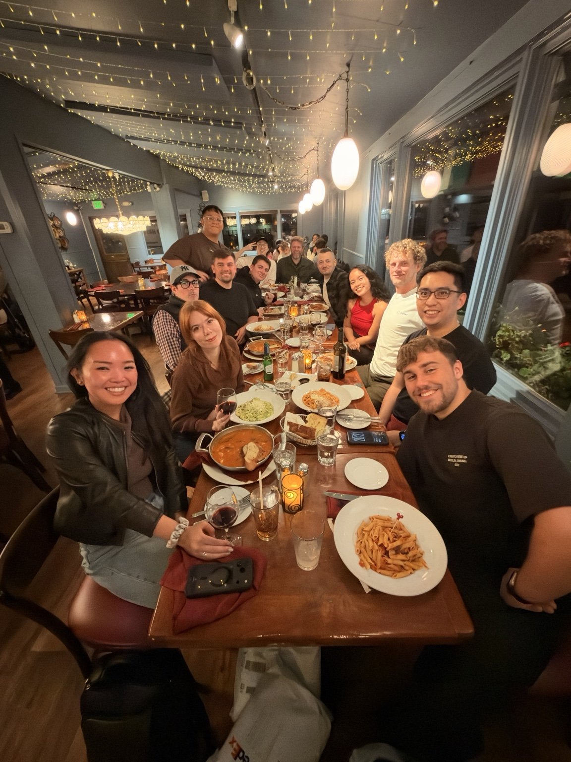 Codex Ambassadors sharing dinner around a long restaurant table in San Francisco