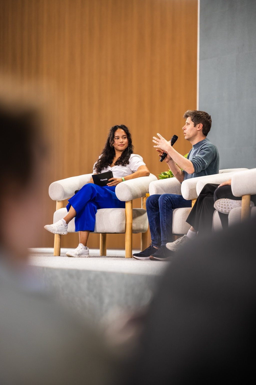 Pauline listening as Sam Altman answers a question during the closing DevDay Q&A